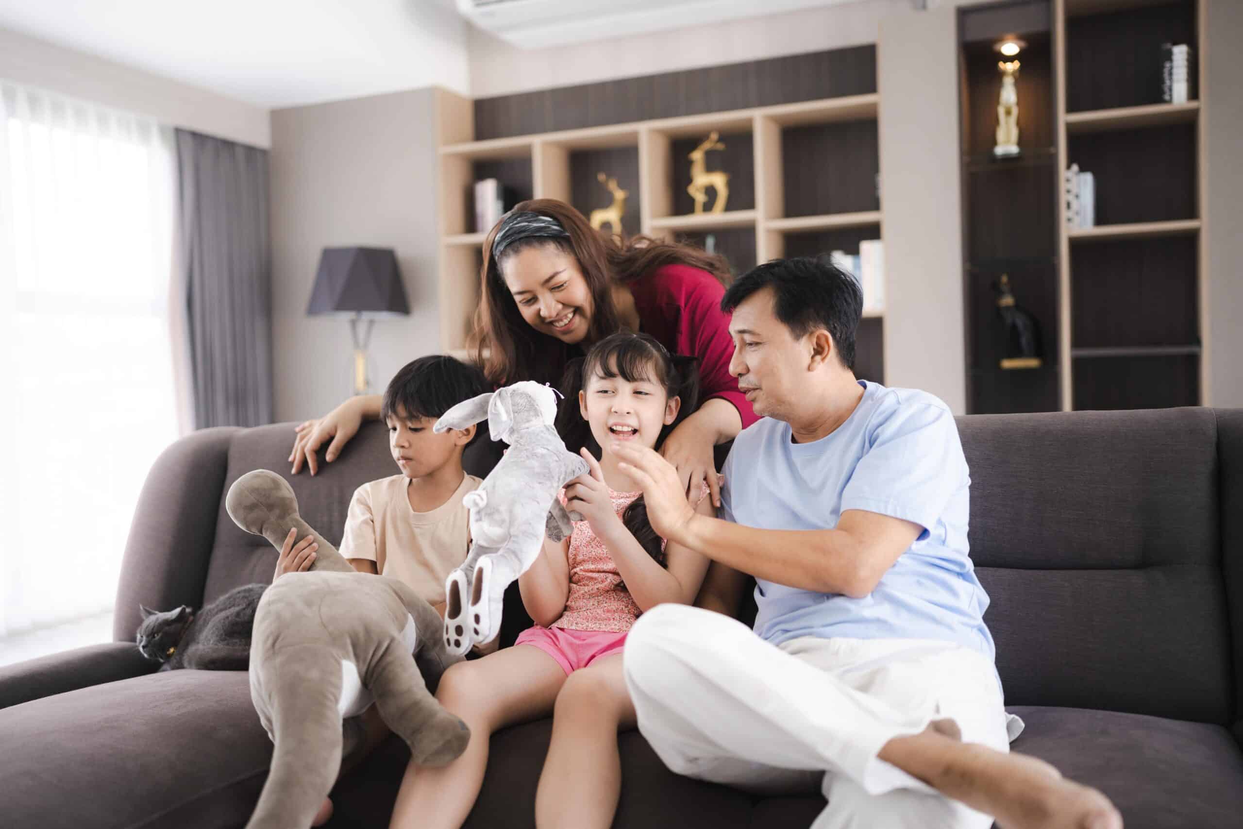 Family-Safe Pest Control Protecting Huntsville Homes A mother playing with her children in their home