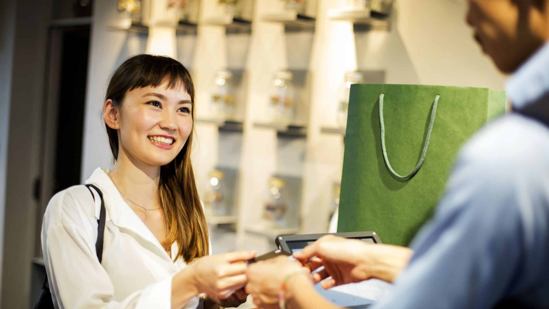 Pest-free commercial retail environment with happy customer and clerk