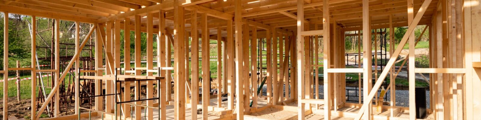 Interior frame of new wooden house under construction Construction site of a new residential home