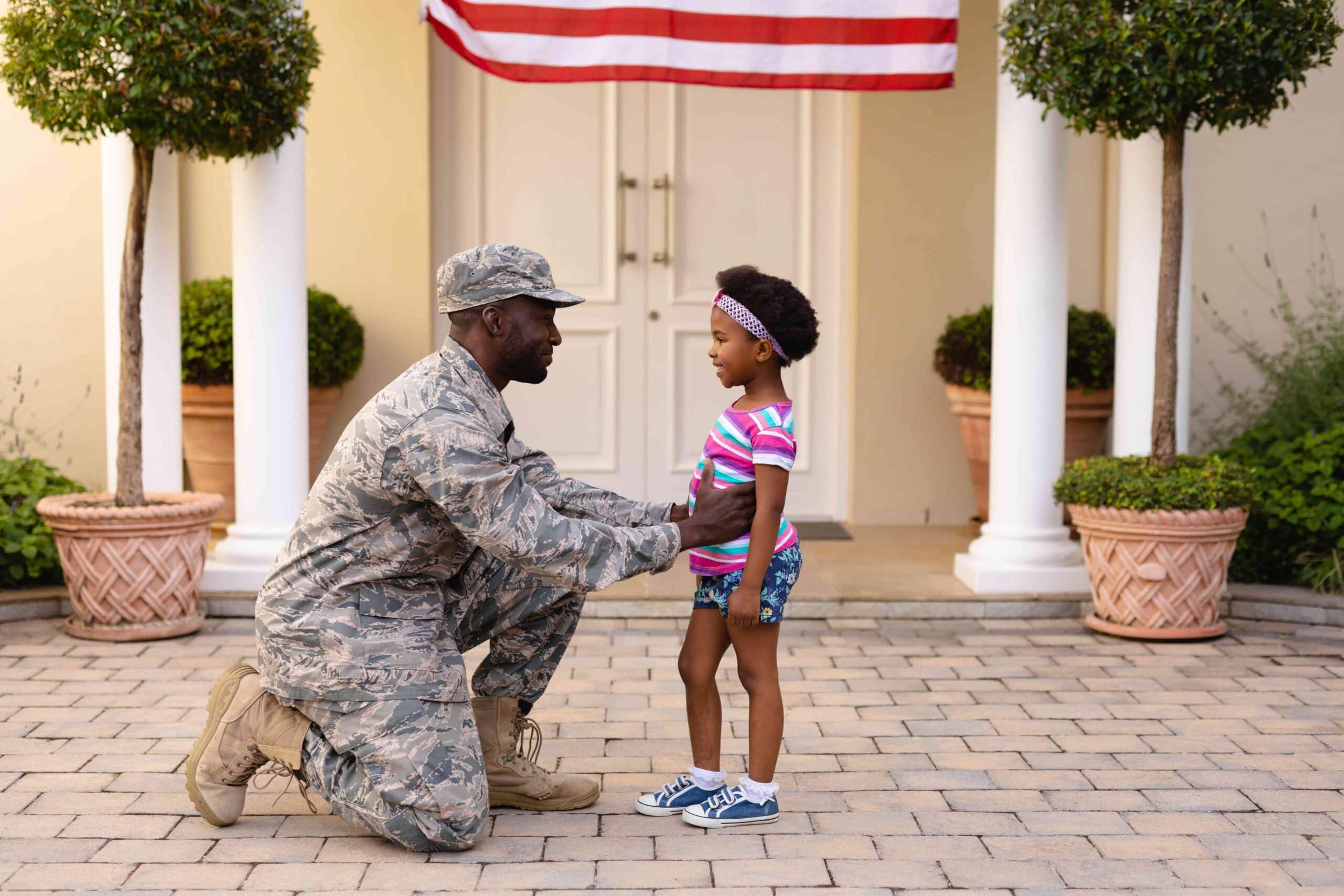 Soldier interacting with a young child at the Redstone Arsenal base