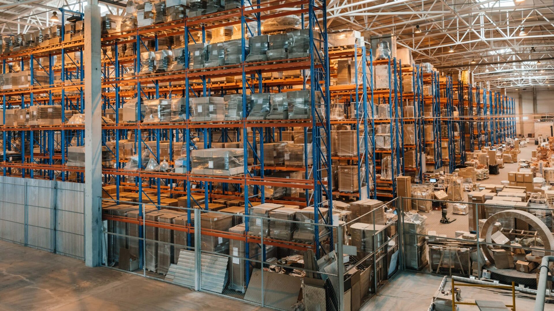 A large industrial warehouse filled with boxes and containers